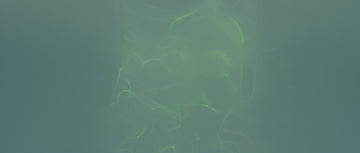 Swirling green vapor on a dark background