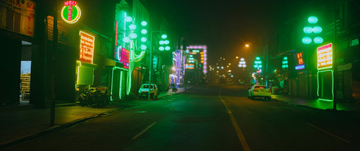 Vibrant neon-lit city street at night